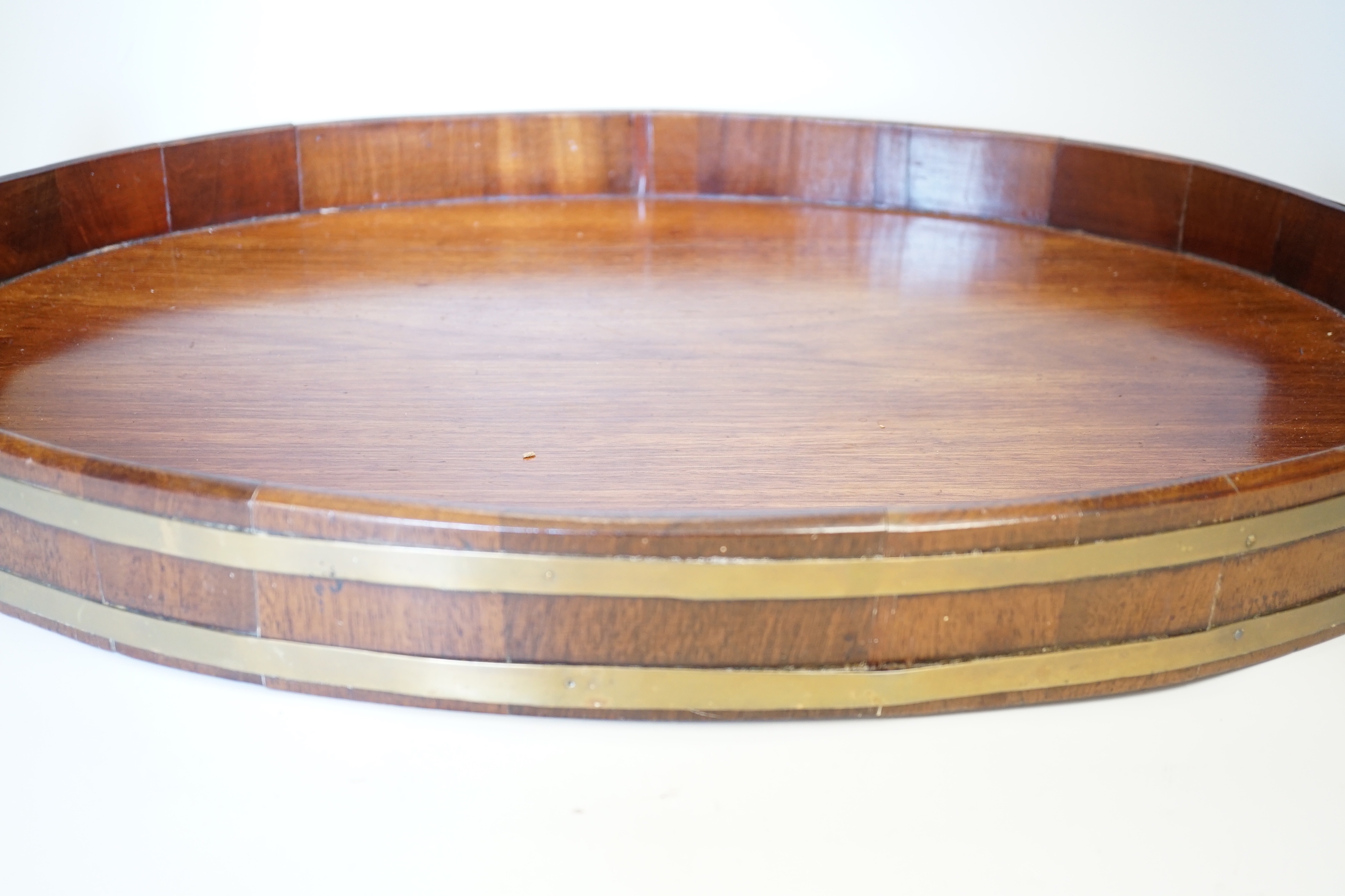 A late Georgian brass-bound mahogany tray, 58cm wide